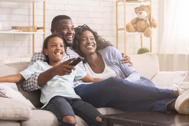 Happy family watching TV. 