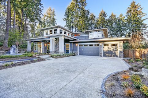 The front yard of a large house.