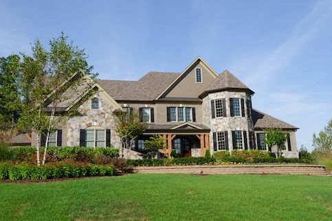 Large house with a big green yard