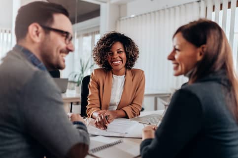 Couple meeting with real estate agent.