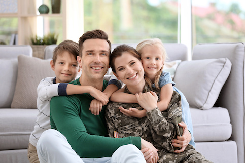 Happy military family in their new home.