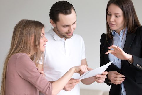 Couple reviewing mortgage commitment letter.