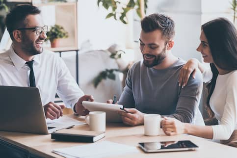 Couple looking over a document together.