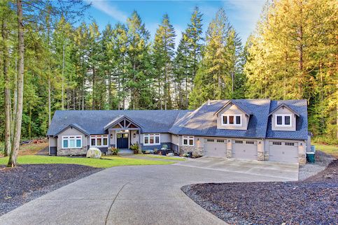 House at the end of a long manicured driveway