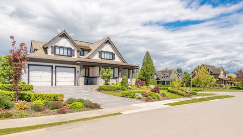 Large house on well-groomed land in neighborhood.