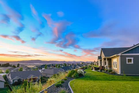 Picture overlooking a neighborhood at sunset.