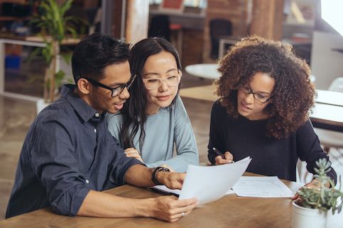 Real estate agent with clients.