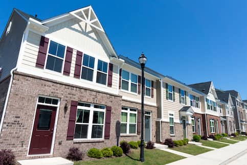 Row of town homes along street.