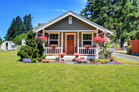 Small house with many flowers.