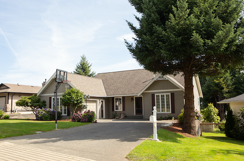 Suburban home with basketball court.