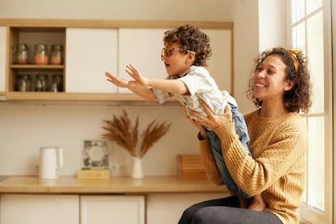 Mother and Son In Kitchen Sharing A Moment of Trust 