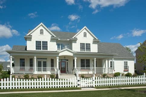 Large White Farm House With Fence