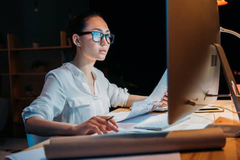 Woman in Glasses Working On Computer