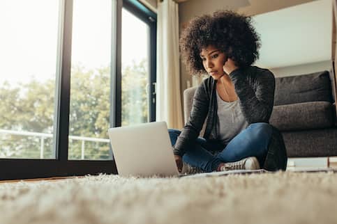 Woman Natural Hair Looking At Laptop