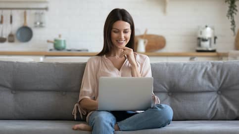 woman on laptop on couch