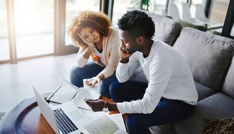 African-American couple working on the computer together.