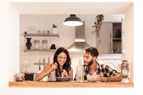 Young couple eating together. 