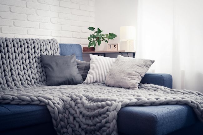 Cozy blue color themed couch.