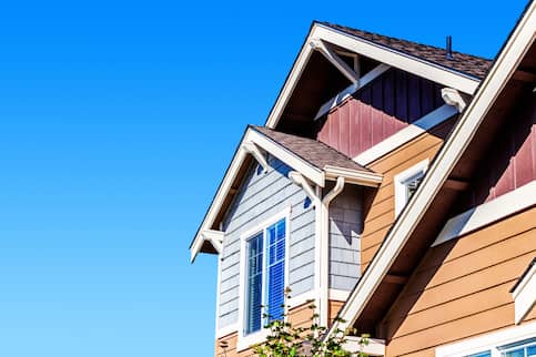 Close up of a window on the second story of a house.