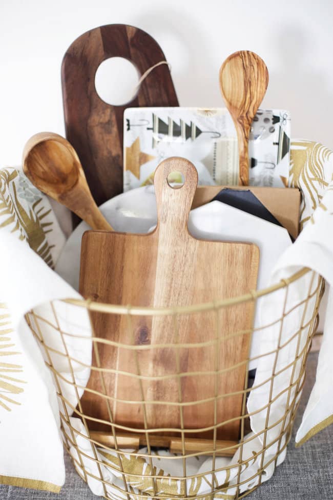 Kitchen gift basket containing cutting boards.