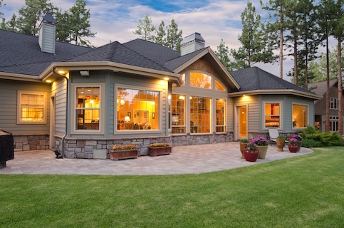 Cottage house warmly lit from the inside.