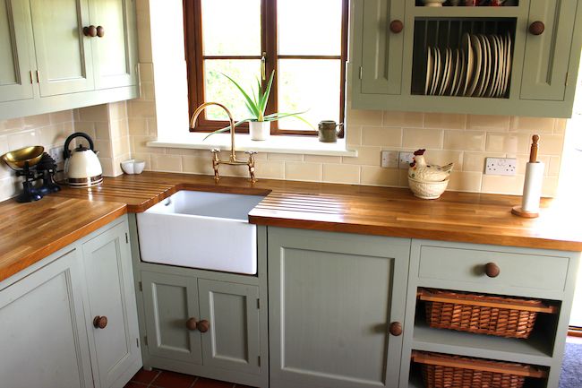 Wooden cabinets and butcher block counters.