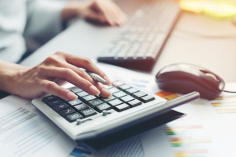 Woman calculating bills.