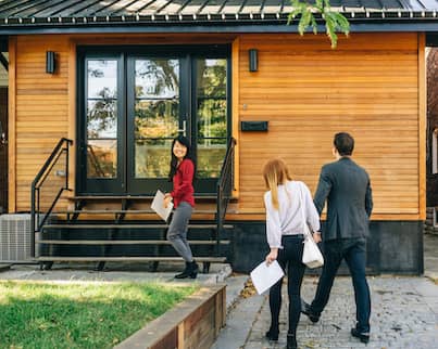 Realtor Showing Tiny House To Couple 