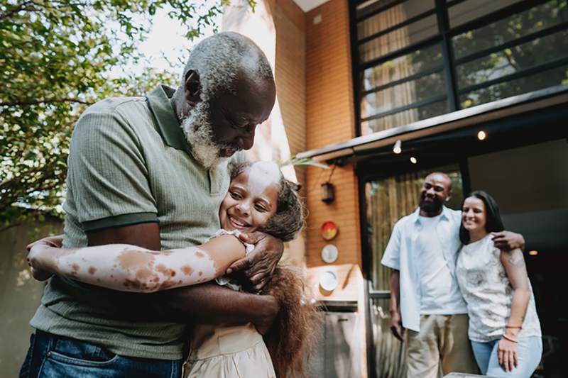 Family visiting home after paying off dad's house.